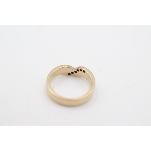 2107 - A hallmarked Birmingham 9ct gold diamond set single row wishbone ring, size J½ - approx. gross weigh... 