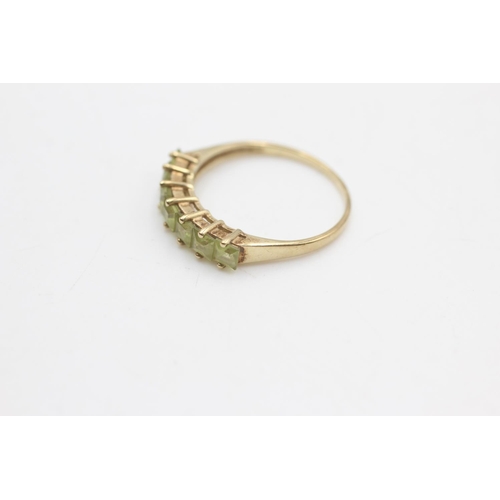 2108 - A 9ct gold peridot seven stone ring, size P½ - approx. gross weight 1.7 grams