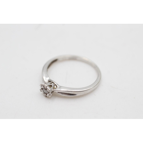 2115 - A 9ct white gold diamond star set ring, size N - approx. gross weight 1.8 grams