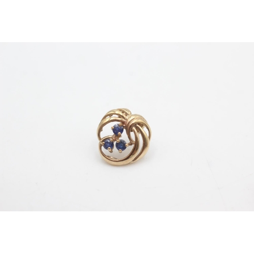 2117 - A pair of 9ct gold sapphire ornate twirl openwork stud earrings - approx. gross weight 2.3 grams