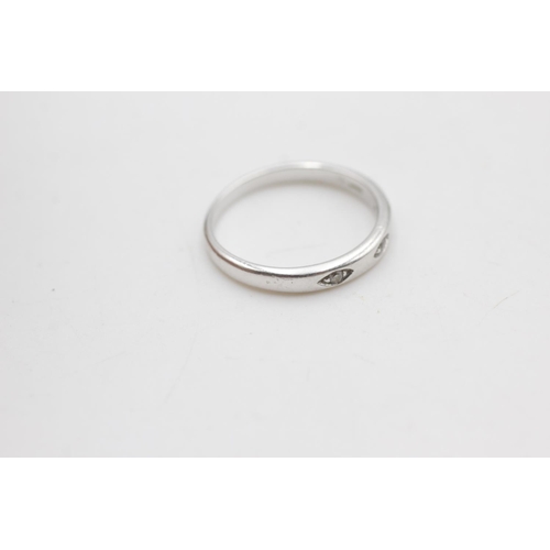 2123 - A 9ct white gold diamond three stone gypsy setting ring, size O - approx. gross weight 2.2 grams