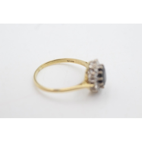 2125 - An 18ct gold sapphire and diamond halo dress ring, size R - approx. gross weight 3.9 grams