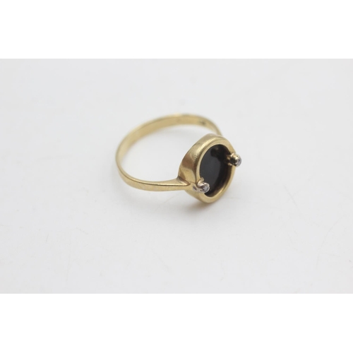 2128 - A 9ct gold onyx and diamond ring, size P - approx. gross weight 2.2 grams