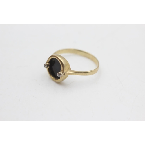 2128 - A 9ct gold onyx and diamond ring, size P - approx. gross weight 2.2 grams