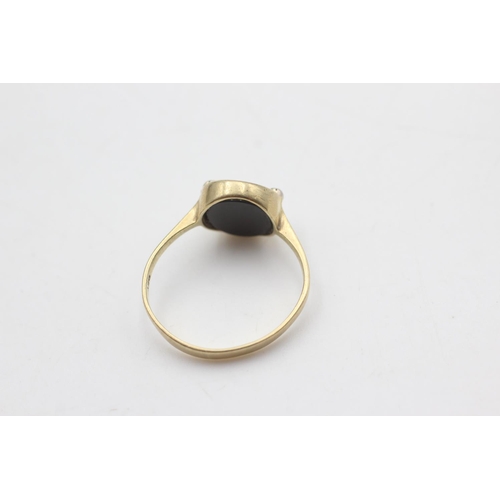 2128 - A 9ct gold onyx and diamond ring, size P - approx. gross weight 2.2 grams