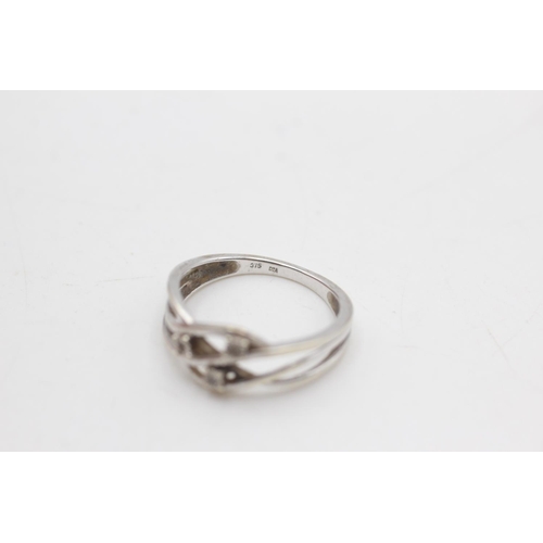 2134 - A 9ct white gold diamond twist knot band ring, size N½ - approx. gross weight 2 grams