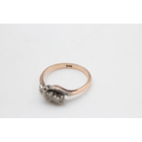 2135 - A 9ct rose gold twist band clear gemstone ring, size Q - approx. gross weight 3 grams