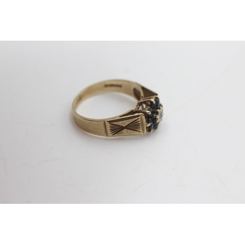 2138 - A hallmarked London 9ct gold diamond and sapphire floral cluster dress ring, size N - approx. gross ... 