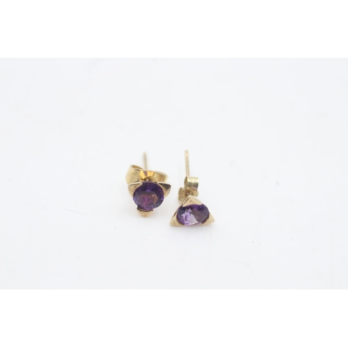 2141 - Two pairs of 9ct gold amethyst stud earrings, one pair with diamond - approx. .gross weight 2.4 gram... 