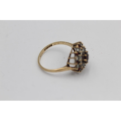 2143 - A hallmarked Birmingham 9ct gold garnet and synthetic spinel double halo dress ring, size P½ - appro... 