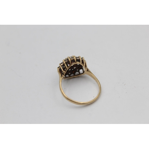 2143 - A hallmarked Birmingham 9ct gold garnet and synthetic spinel double halo dress ring, size P½ - appro... 