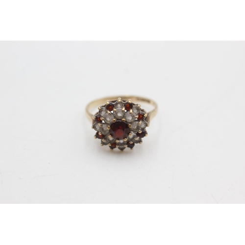 2143 - A hallmarked Birmingham 9ct gold garnet and synthetic spinel double halo dress ring, size P½ - appro... 