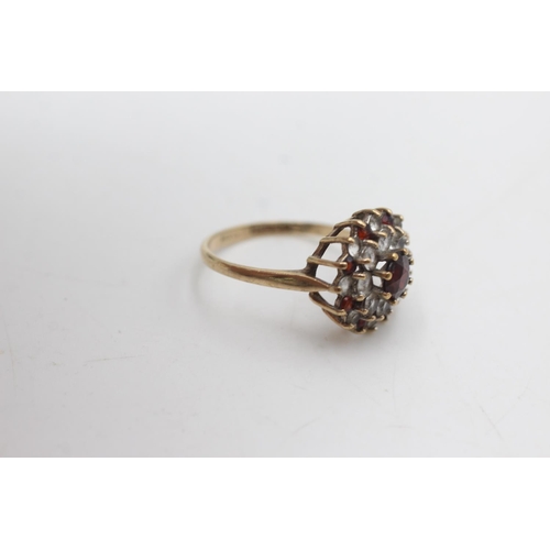 2143 - A hallmarked Birmingham 9ct gold garnet and synthetic spinel double halo dress ring, size P½ - appro... 