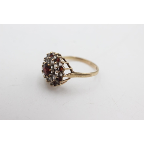 2143 - A hallmarked Birmingham 9ct gold garnet and synthetic spinel double halo dress ring, size P½ - appro... 