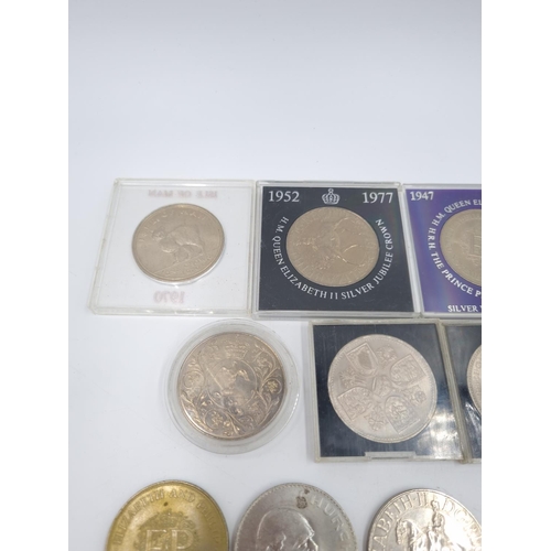 77 - A large collection of assorted commemorative coins to include Elizabeth II 1977 Silver Jubilee crown... 