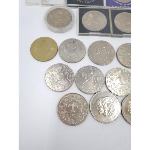 77 - A large collection of assorted commemorative coins to include Elizabeth II 1977 Silver Jubilee crown... 