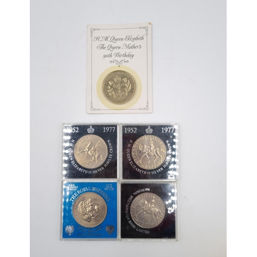 75 - A collection of assorted cased coins to include Coronation crowns, Britain's First decimal coin set ... 