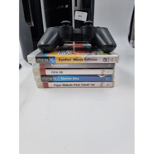 1519 - Two Sony PlayStation 3 consoles, one slim and one original, various accessories and games to include... 