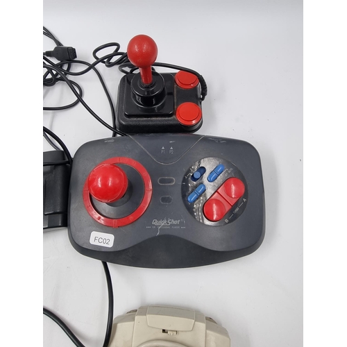 1516 - Seven assorted vintage joysticks and gaming accessories