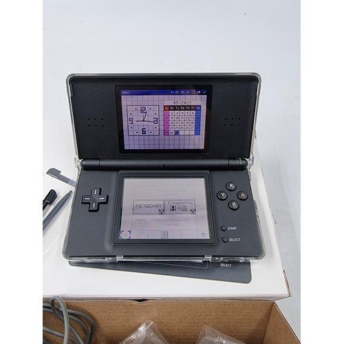 1515 - A boxed Nintendo DS lite handheld console