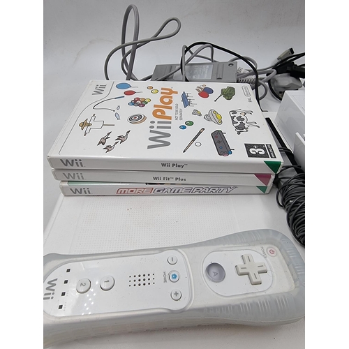 1511 - A collection of Nintendo Wii items to include Wii Fit board, accessories and games