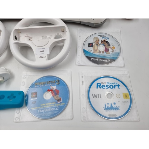 1511 - A collection of Nintendo Wii items to include Wii Fit board, accessories and games