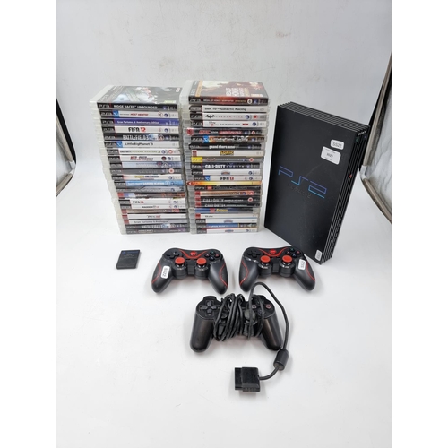 1507 - A collection of various Sony PlayStation items to include PlayStation 2 console with controllers and... 