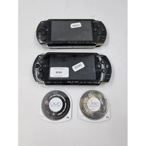 1505 - Two Sony PSP hand held game consoles with 2 UMD game discs