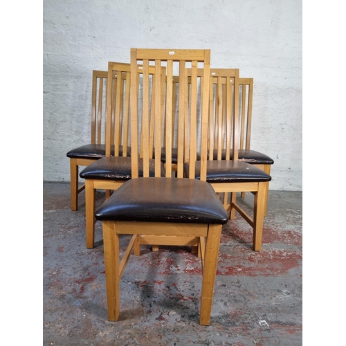 1050 - A set of six modern light oak high back dining chairs with brown leatherette seats - approx. 109cm h... 