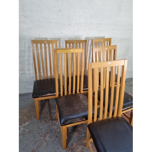 1050 - A set of six modern light oak high back dining chairs with brown leatherette seats - approx. 109cm h... 