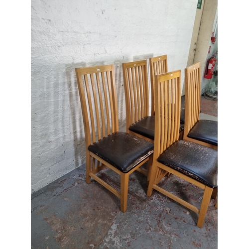 1050 - A set of six modern light oak high back dining chairs with brown leatherette seats - approx. 109cm h... 