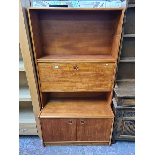 1135 - A 1960s teak bureau cabinet with two lower cupboard doors, fall front and upper shelf - approx. 167c... 