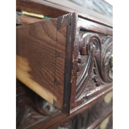 1001 - A Victorian Gothic Revival carved oak bureau with four drawers, fall front and fitted interior  - ap... 