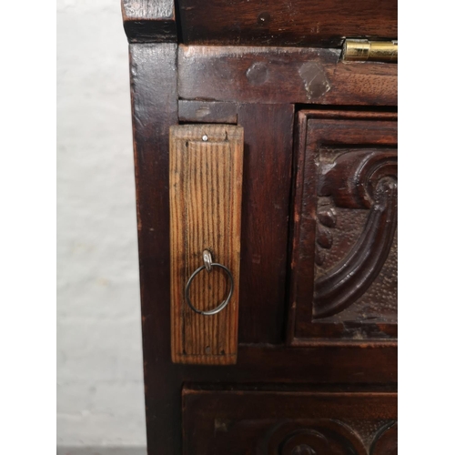 1001 - A Victorian Gothic Revival carved oak bureau with four drawers, fall front and fitted interior  - ap... 