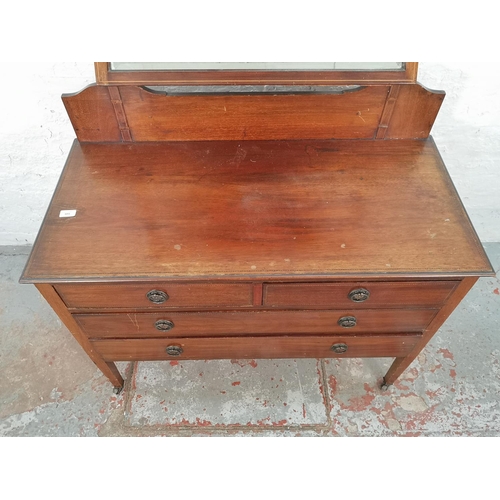 1011 - An Edwardian inlaid mahogany dressing chest with upper bevelled edge mirror, two short drawers and t... 