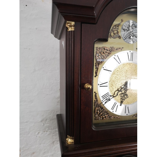 1016 - A mahogany cased Grandfather clock with Tempus Fugit face, pendulum and three weights - approx. 195c... 