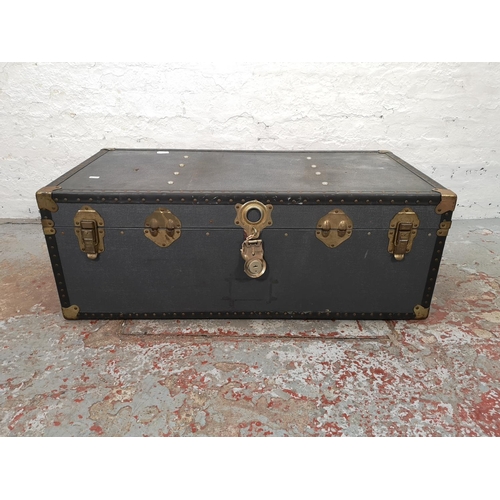 1021 - An early 20th century blue and brass mounted travel trunk - approx. 36cm high x 100cm wide x 52cm de... 