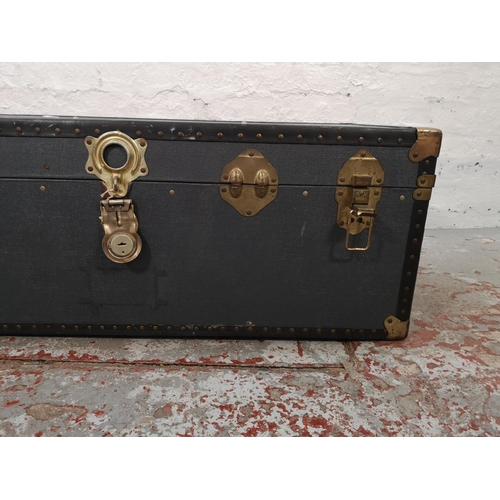 1021 - An early 20th century blue and brass mounted travel trunk - approx. 36cm high x 100cm wide x 52cm de... 