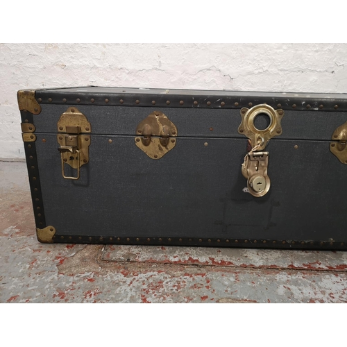 1021 - An early 20th century blue and brass mounted travel trunk - approx. 36cm high x 100cm wide x 52cm de... 