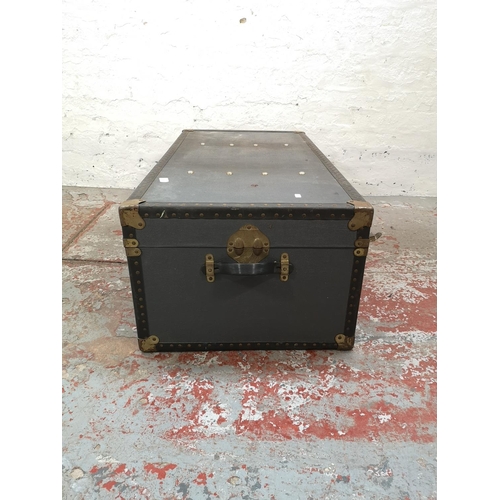 1021 - An early 20th century blue and brass mounted travel trunk - approx. 36cm high x 100cm wide x 52cm de... 