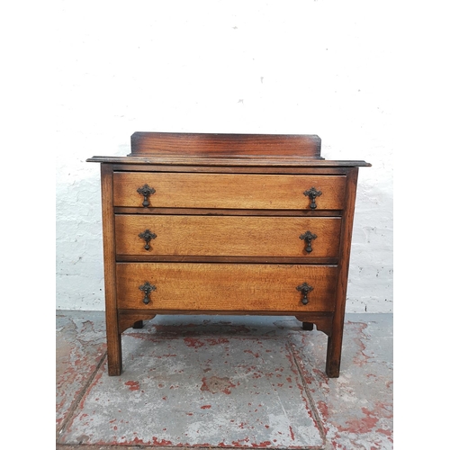 1023 - A 1930s oak chest of three drawers - approx. 86cm high x 88cm wide x 41cm deep