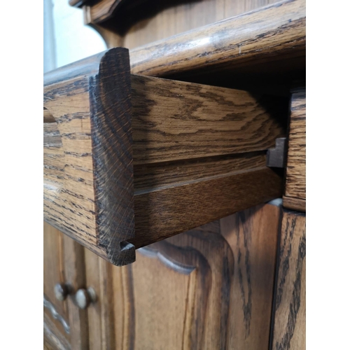 1024 - A late 20th century oak sideboard with three drawers and three lower cupboard doors - approx. 116cm ... 