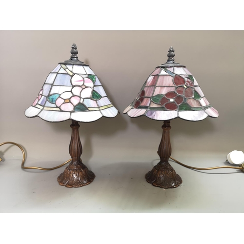 1025 - A pair of bronze effect table lamps with Tiffany style shades - approx. 37cm high