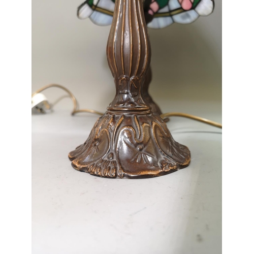 1025 - A pair of bronze effect table lamps with Tiffany style shades - approx. 37cm high