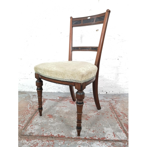 1026 - A pair of Edwardian carved mahogany and ebonised dining chairs with green upholstery