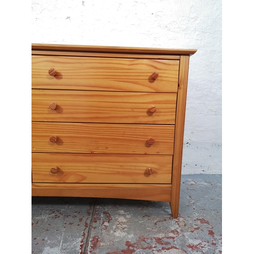 1027 - A modern pine sideboard with four drawers and three shelves - approx. 72cm high x 116cm wide x 40cm ... 