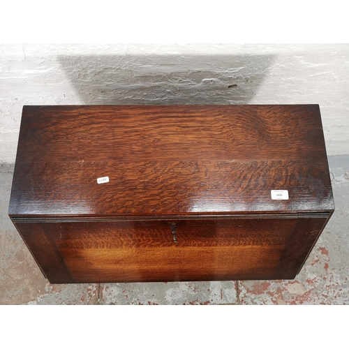 1028 - A 1930s oak bureau with two drawers, fall front and fitted interior - approx. 99cm high x 72cm wide ... 