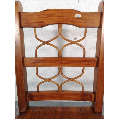 1031 - A set of four modern hardwood and wicker ladder back dining chairs