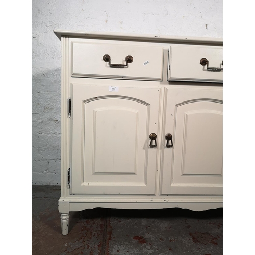 1034 - A modern white painted sideboard with three drawers and three lower cupboard doors - approx. 84cm hi... 