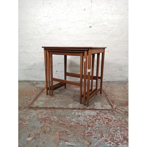 1038A - A teak nest of three tables - largest approx. 52cm high x 54cm wide x 39cm deep